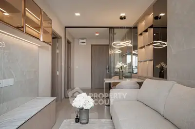 Modern living room with elegant decor and stylish lighting in a contemporary apartment.