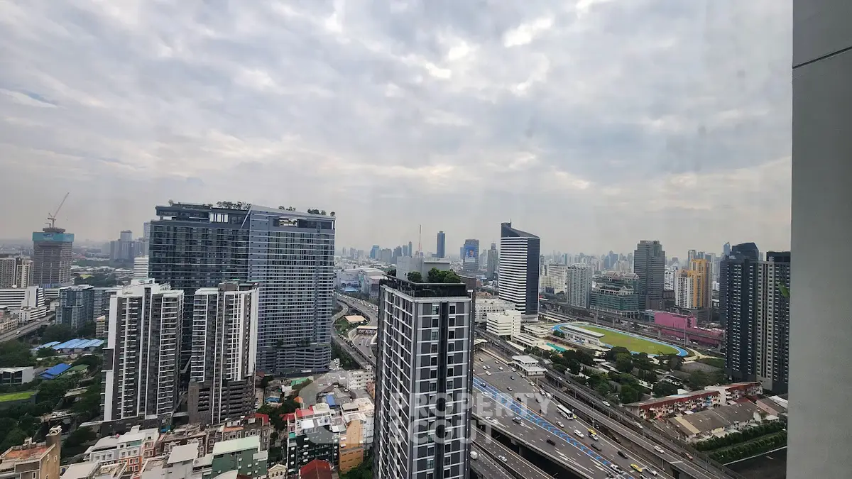 Stunning cityscape view from high-rise building with expansive skyline and modern architecture.