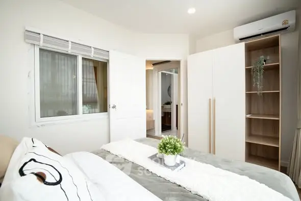 Modern bedroom with stylish decor and natural light