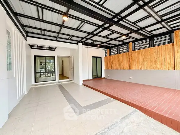 Spacious modern entrance with sleek design and wooden accents