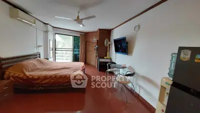 Spacious bedroom with balcony access and modern amenities