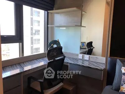 Modern study area with sleek desk and ergonomic chair in high-rise apartment