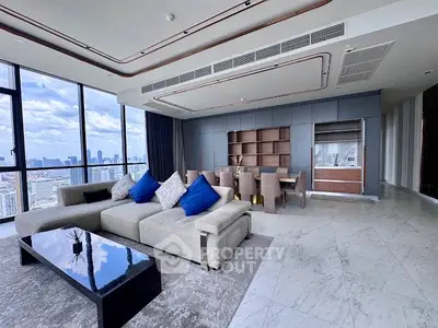 Luxurious modern living room with panoramic city views and elegant furnishings.