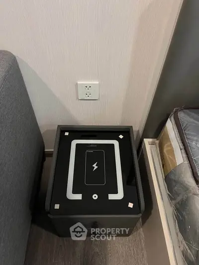 Modern bedroom with sleek wireless charging station and stylish decor