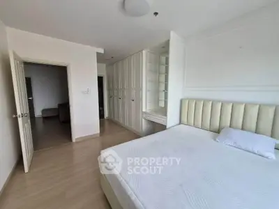 Spacious bedroom with built-in wardrobe and minimalist decor