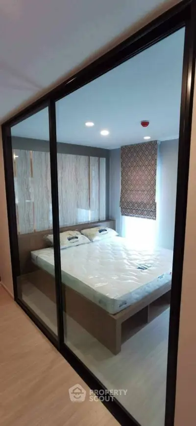 Modern bedroom with glass partition and stylish decor