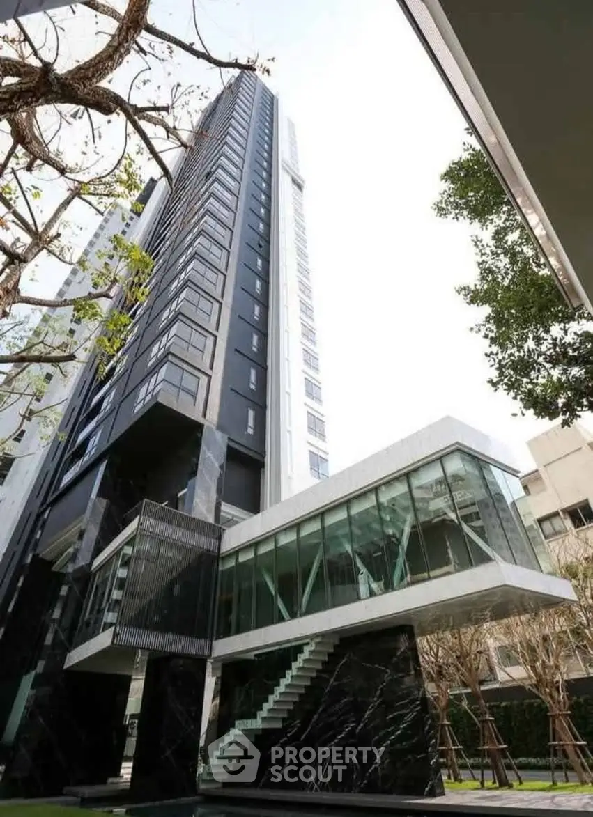 Modern high-rise building with sleek glass and metal architecture