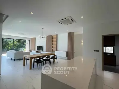 Spacious modern living room with open layout and elegant dining area