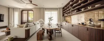 Luxurious living room with elegant decor and open kitchen layout, featuring modern furniture and stylish shelving.