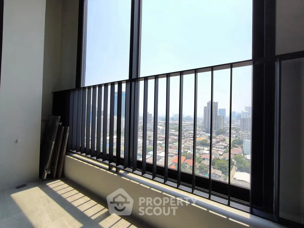 Stunning city view from high-rise balcony with sleek railing design