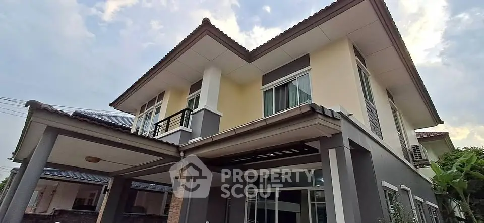 Modern two-story house with stylish exterior and large windows, perfect for family living.