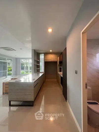 Modern kitchen with sleek design and open layout in a bright, spacious home.