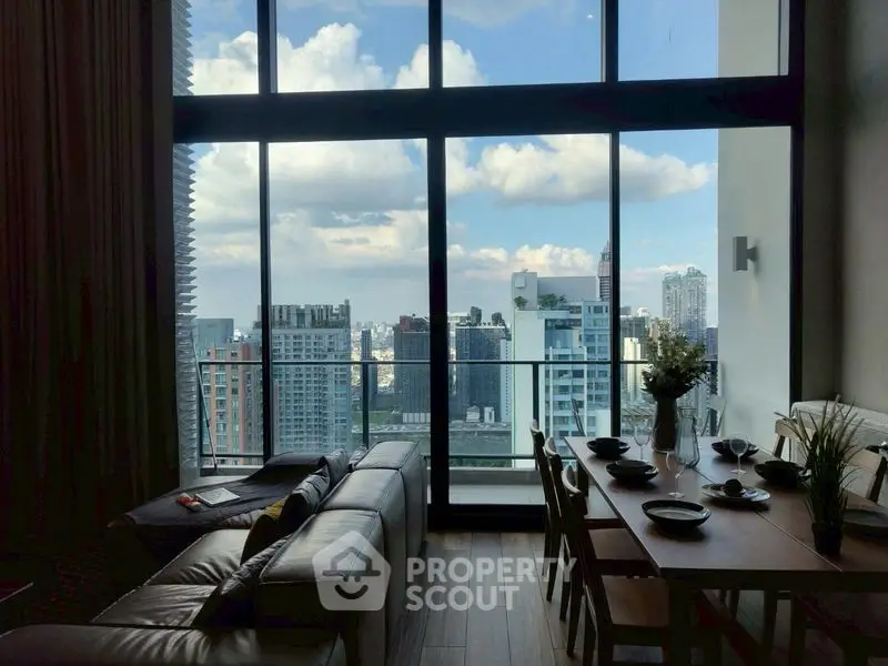 Luxurious high-rise living room with stunning city view and elegant dining area.