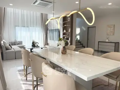 Luxurious modern living room with elegant dining area and stylish lighting