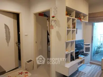 Modern living room with stylish shelving and balcony view