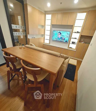 Modern living room with wooden furniture and built-in TV unit