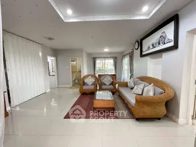Spacious living room with elegant wicker furniture and modern decor