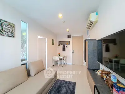 Modern living room with sleek furniture and air conditioning in a stylish apartment.