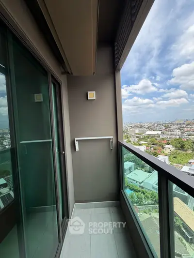 Modern balcony with glass railing offering stunning cityscape views