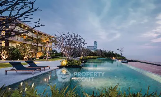 Luxurious beachfront property with stunning infinity pool and modern architecture.