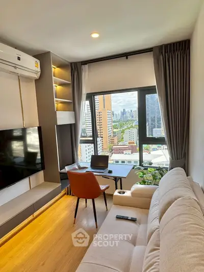 Modern living room with city view, featuring a cozy sofa, wall-mounted TV, and stylish decor.