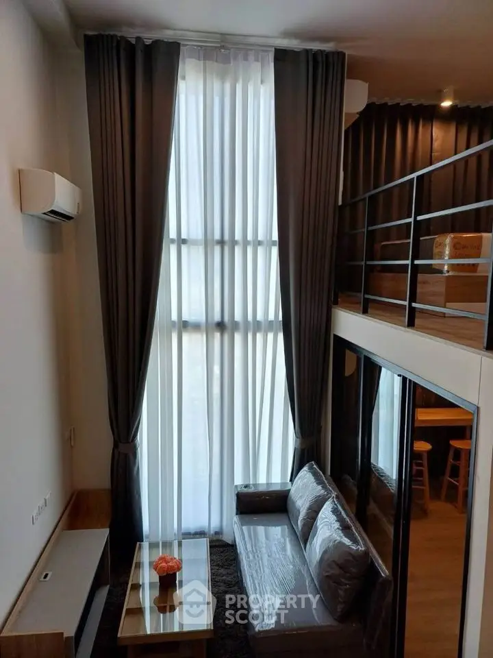 Modern loft apartment with high ceilings and large windows