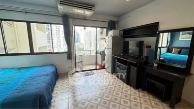 Cozy studio apartment with balcony and city view