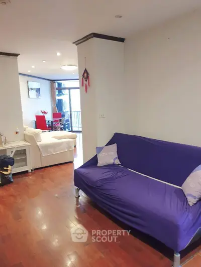 Spacious living room with modern decor and hardwood floors