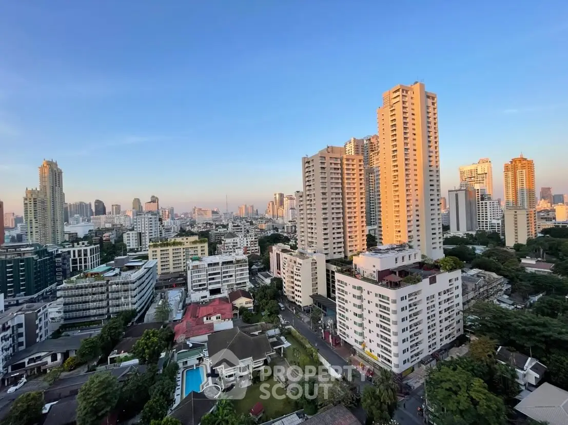 Stunning cityscape view showcasing high-rise buildings and urban skyline at sunset.