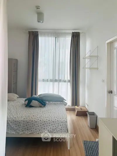 Cozy bedroom with natural light and modern decor