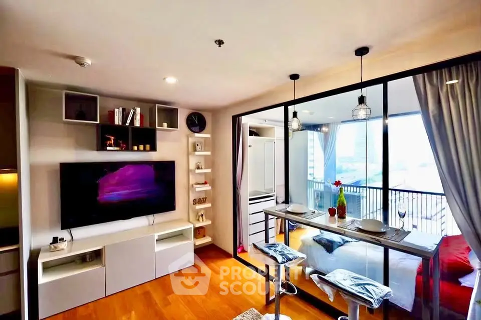 Modern studio apartment with open layout and city view balcony