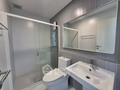 Modern bathroom with sleek shower and contemporary fixtures