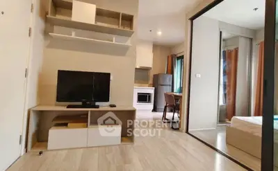 Modern apartment interior with open layout, featuring a cozy living area and sleek kitchen design.