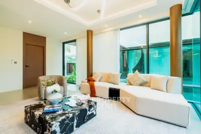Luxurious modern living room with elegant decor and pool view
