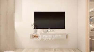 Modern minimalist living room with wall-mounted TV and sleek decor.