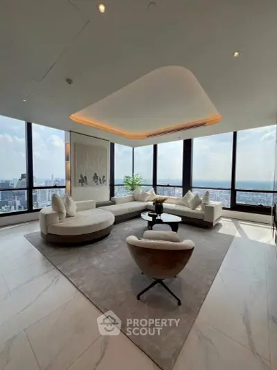 Luxurious living room with panoramic city views and modern furniture.