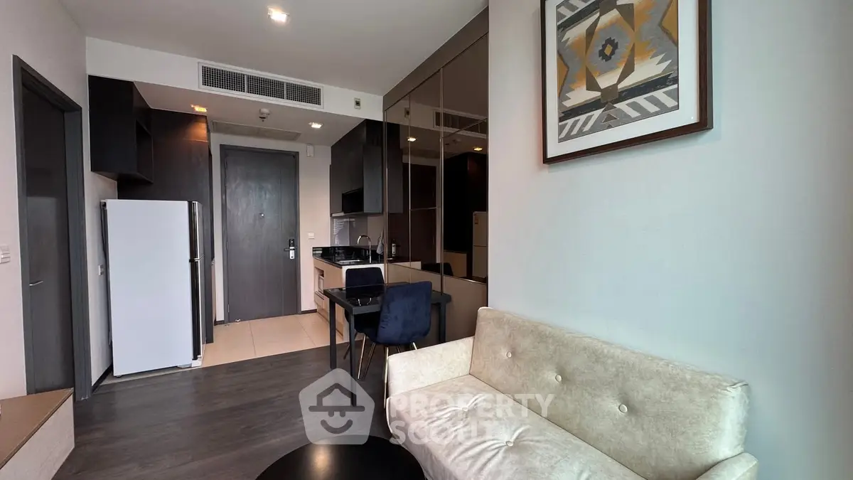 Modern apartment interior with cozy living room and compact kitchen