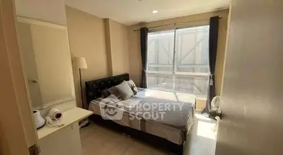 Cozy bedroom with natural light and modern decor in urban apartment