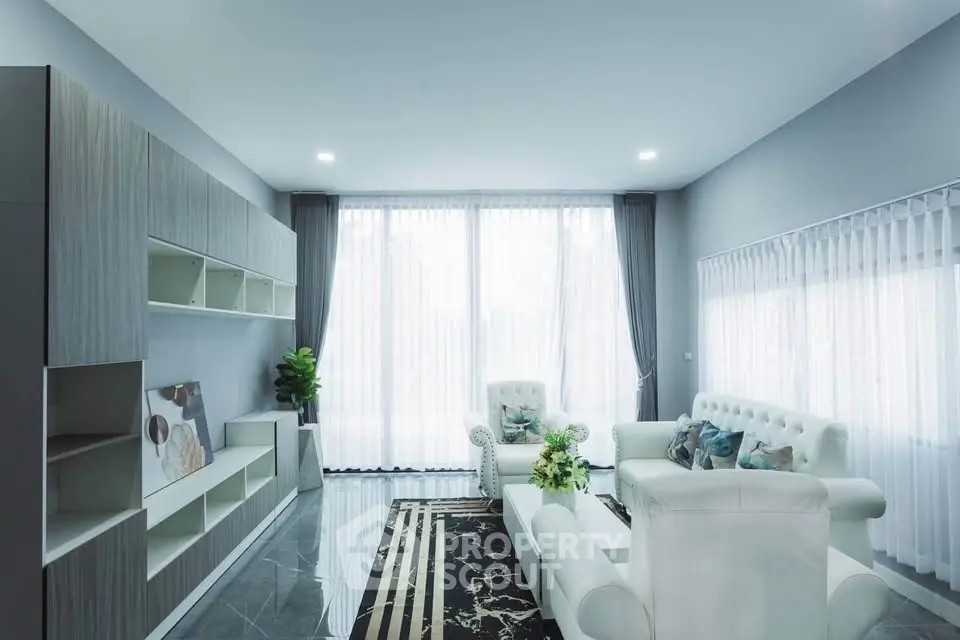 Elegant modern living room with large windows and stylish furniture