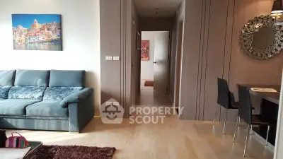 Modern living room with stylish decor and cozy seating area in a contemporary apartment.