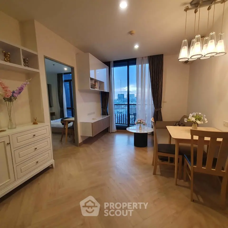 Modern living room with dining area and city view balcony in stylish apartment