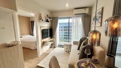 Modern living room with cozy decor and natural light in a stylish apartment