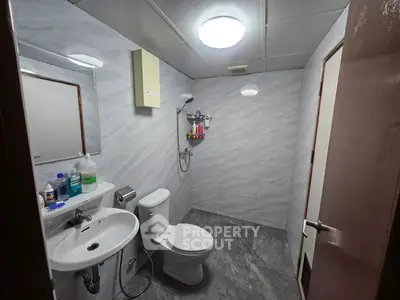 Modern bathroom with sleek design and essential fixtures, perfect for a contemporary home.