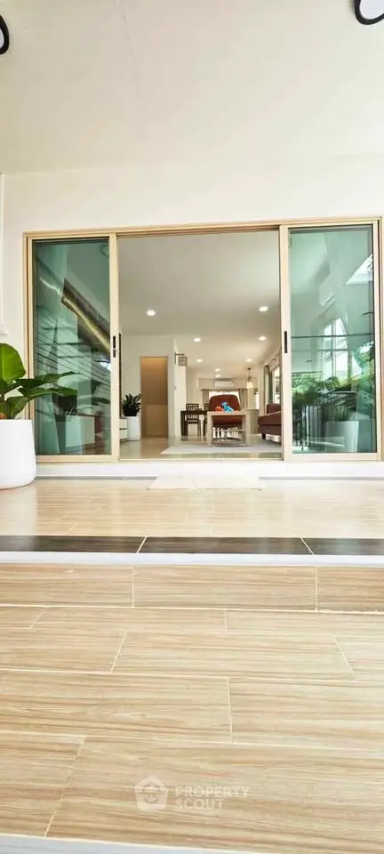 Modern living room with sliding glass doors and stylish interior design