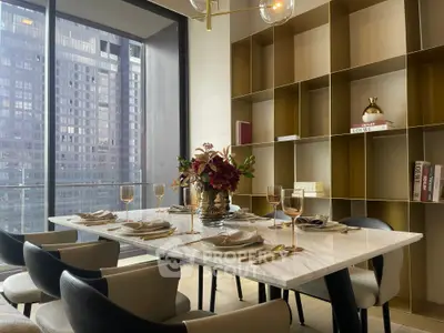 Luxurious dining room with elegant table setting and city view, perfect for upscale living.