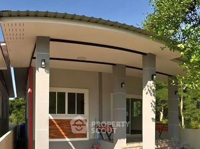 Charming modern house exterior with sleek design and inviting porch