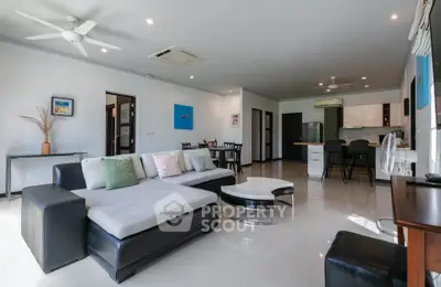 Spacious modern living room with open kitchen and stylish decor