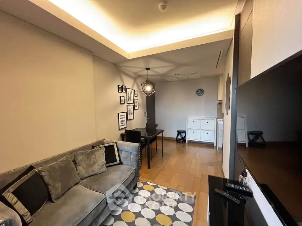 Modern living room with stylish decor and cozy seating area, perfect for relaxation and entertainment.