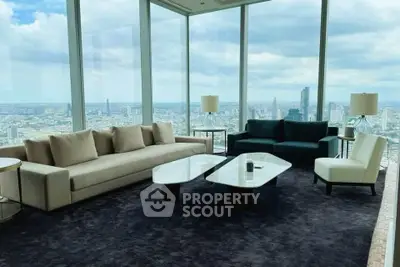 Luxurious living room with panoramic city views and elegant modern furniture.