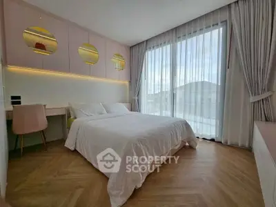 Modern bedroom with large window and stylish decor